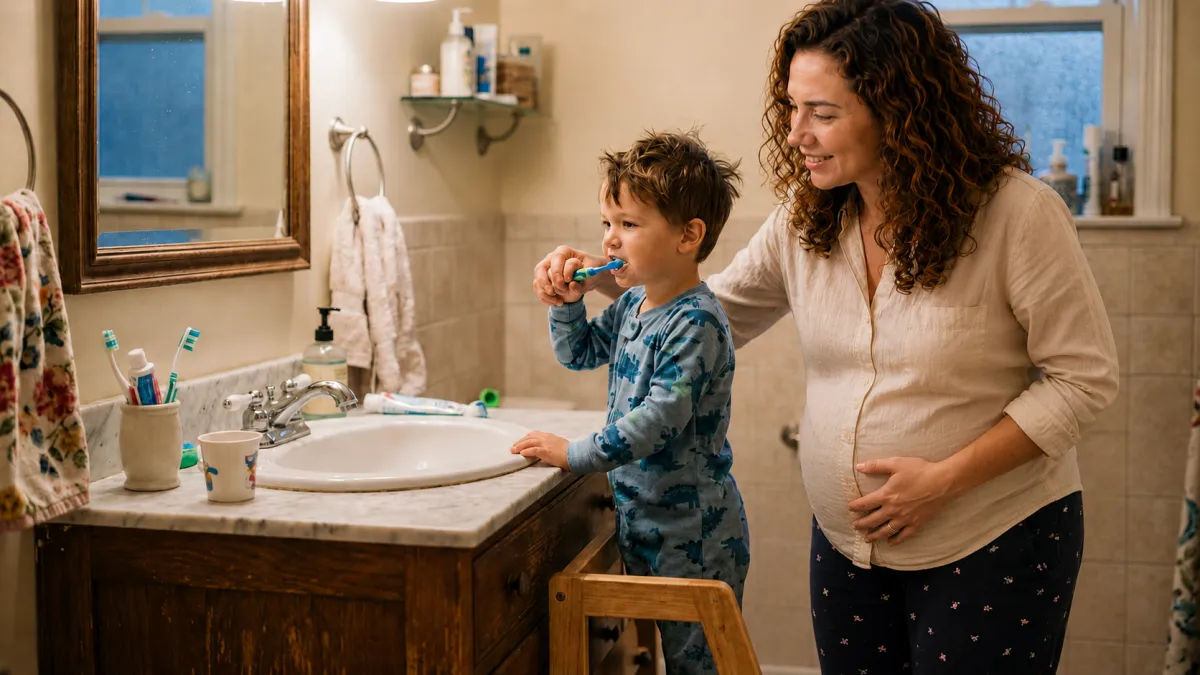 Pregnant mother helping child brush teeth
